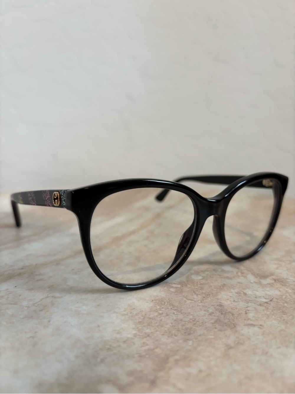 Gucci GG0329O 004 Black Round Eyeglasses with Gold Logo Accent